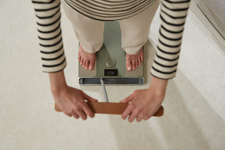 Woman tracking her InBody Score at home with InBody Dial H40